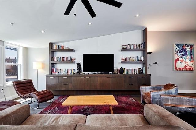 living room featuring dark hardwood / wood-style floors and ceiling fan