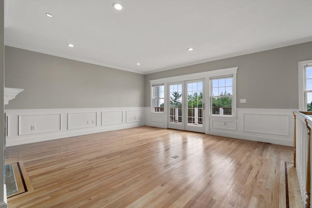 21 Musquashicut Ave Unit 27, Scituate, MA 02066 - empty room with crown molding, light wood-style floors, a wainscoted wall, and recessed lighting