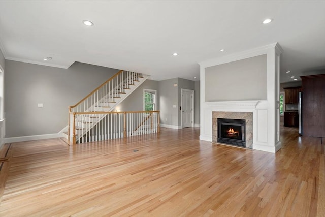 21 Musquashicut Ave Unit 27, Scituate, MA 02066 - unfurnished living room with crown molding, stairway, baseboards, recessed lighting, and light wood-style flooring