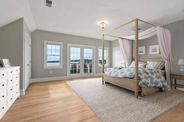 21 Musquashicut Ave Unit 27, Scituate, MA 02066 - bedroom featuring light wood-style floors, baseboards, and access to outside
