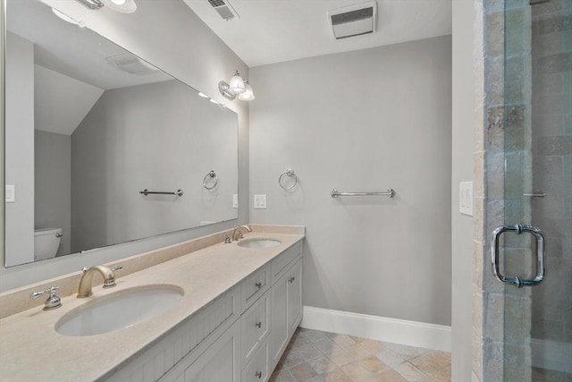 21 Musquashicut Ave Unit 27, Scituate, MA 02066 - bathroom with toilet, double vanity, a shower stall, and baseboards