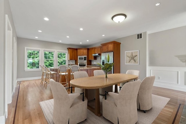 21 Musquashicut Ave Unit 27, Scituate, MA 02066 - dining area with recessed lighting, light wood-type flooring, a wainscoted wall, and baseboards