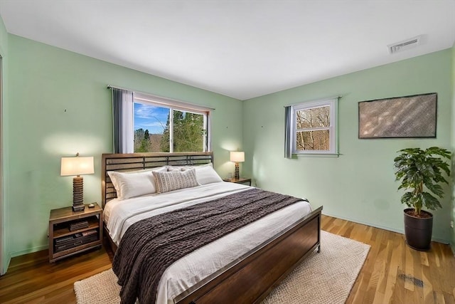 bedroom with hardwood / wood-style floors