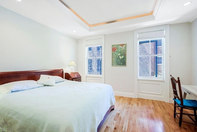 44 Dartmouth St Unit 1, Boston, MA 02116 - bedroom with crown molding, light wood finished floors, a tray ceiling, and multiple windows