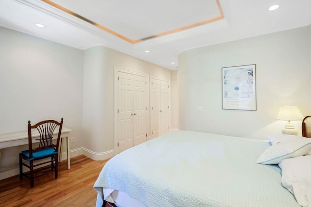 44 Dartmouth St Unit 1, Boston, MA 02116 - bedroom with recessed lighting, baseboards, wood finished floors, and a raised ceiling