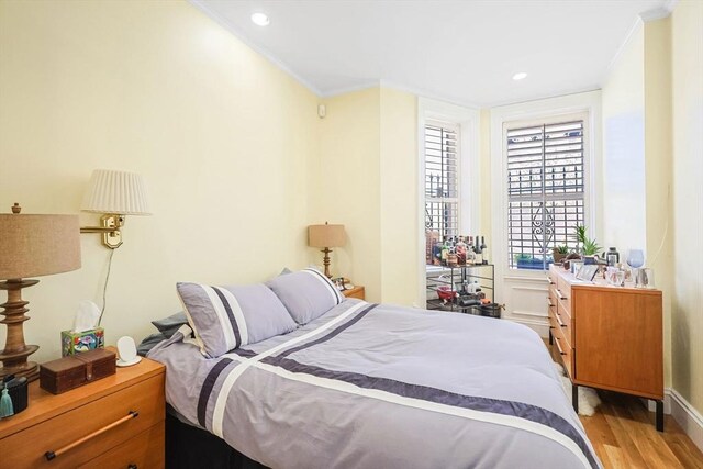 44 Dartmouth St Unit 1, Boston, MA 02116 - bedroom with crown molding, recessed lighting, baseboards, and light wood-type flooring
