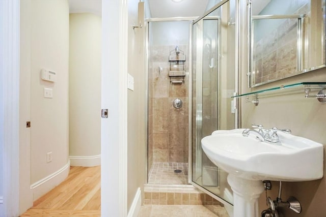 44 Dartmouth St Unit 1, Boston, MA 02116 - full bath with baseboards, a shower stall, and wood finished floors