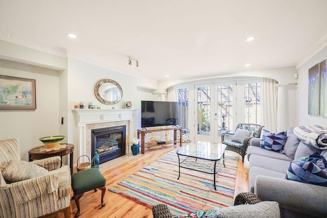 44 Dartmouth St Unit 1, Boston, MA 02116 - living area with french doors, recessed lighting, wood finished floors, and a tile fireplace