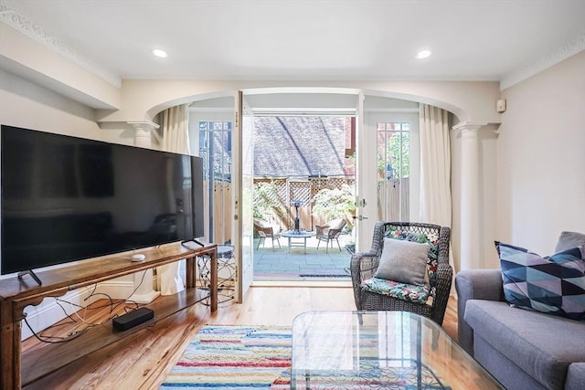 44 Dartmouth St Unit 1, Boston, MA 02116 - living area with ornate columns, arched walkways, and wood finished floors
