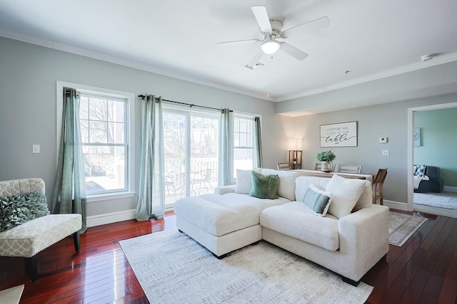 living room featuring ceiling fan, hardwood / wood-style floors, and crown molding