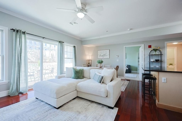 living room with ceiling fan, crown molding, and hardwood / wood-style floors