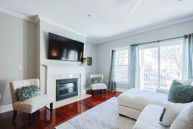 living room featuring ceiling fan, ornamental molding, and hardwood / wood-style floors