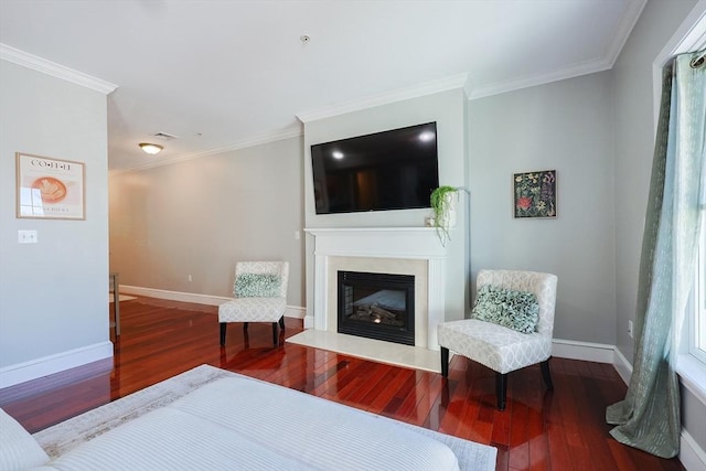 living room with wood-type flooring and ornamental molding