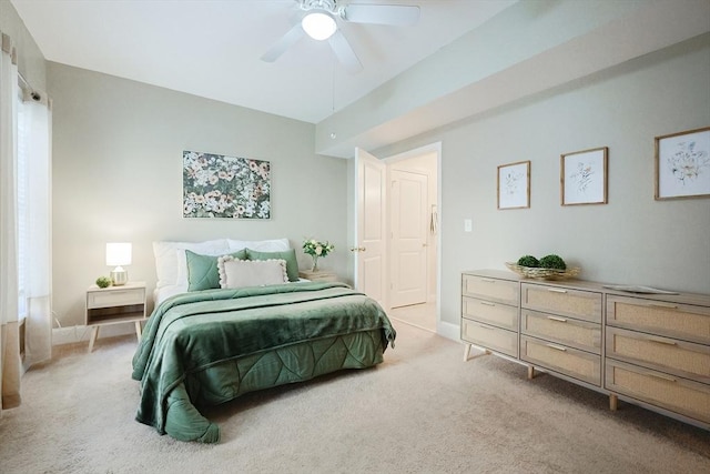 bedroom featuring light carpet and ceiling fan