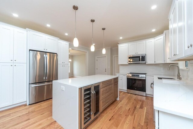 LOT0 Pine Hill Rd, Oxford, MA 01537 - kitchen featuring appliances with stainless steel finishes, beverage cooler, a sink, light wood-style floors, and recessed lighting