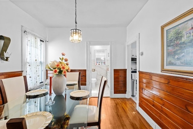 209 Grove St, Brockton, MA 02302 - dining space featuring wainscoting, wood finished floors, and a chandelier