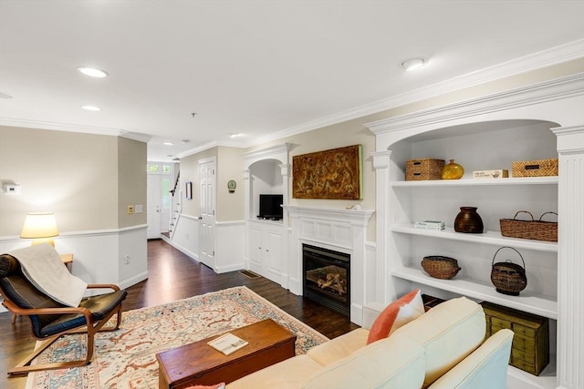 4 Derby Unit B, Salisbury, MA 01952 - living room with crown molding, wood finished floors, a glass covered fireplace, recessed lighting, and arched walkways