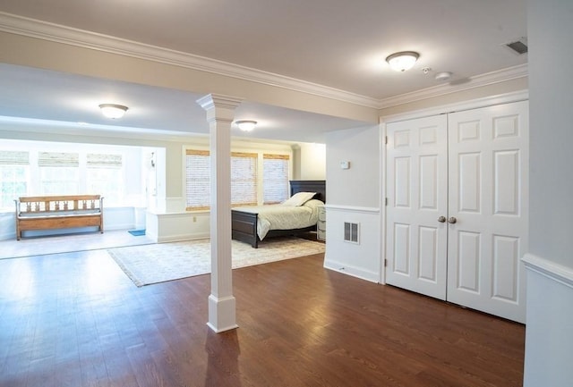 4 Derby Unit B, Salisbury, MA 01952 - bedroom with ornamental molding, dark wood-style flooring, wainscoting, ornate columns, and a decorative wall