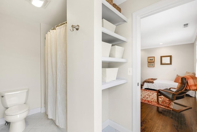 4 Derby Unit B, Salisbury, MA 01952 - ensuite bathroom featuring a shower with curtain and ornamental molding