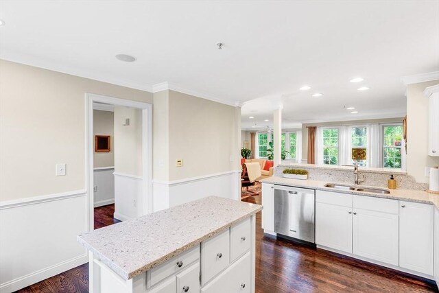4 Derby Unit B, Salisbury, MA 01952 - kitchen featuring stainless steel dishwasher, crown molding, dark wood finished floors, light stone countertops, and white cabinetry