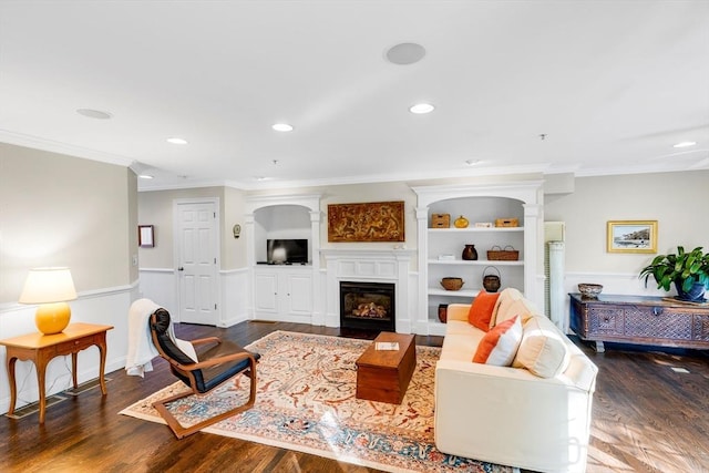4 Derby Unit B, Salisbury, MA 01952 - living area with wood finished floors, a glass covered fireplace, ornamental molding, recessed lighting, and built in features