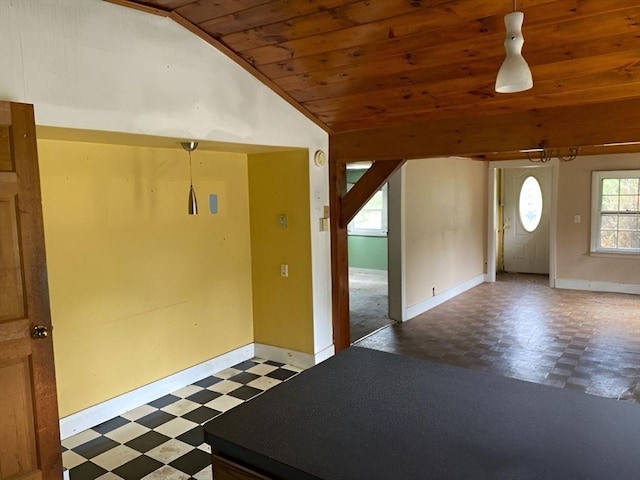 entrance foyer featuring wood ceiling and lofted ceiling