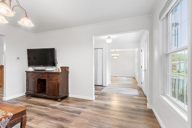 935 Old Keene Rd, Athol, MA 01331 - living room with a chandelier, light wood-style flooring, and crown molding