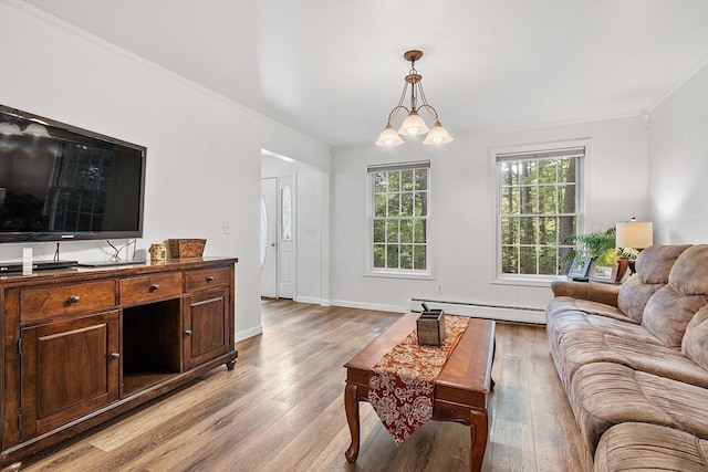 935 Old Keene Rd, Athol, MA 01331 - living area with a baseboard radiator, light wood-type flooring, and ornamental molding