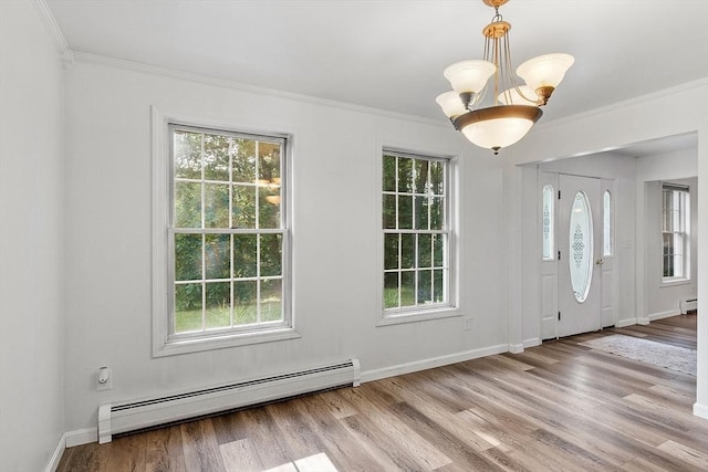 935 Old Keene Rd, Athol, MA 01331 - foyer with a baseboard radiator, healthy amount of natural light, wood finished floors, and crown molding