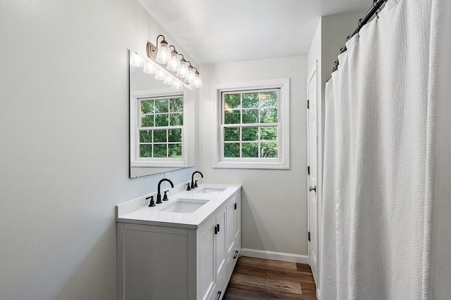 935 Old Keene Rd, Athol, MA 01331 - bathroom featuring double vanity and wood finished floors