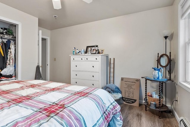 935 Old Keene Rd, Athol, MA 01331 - bedroom with baseboard heating, wood finished floors, a closet, and a ceiling fan
