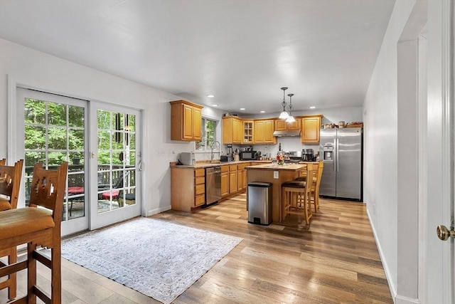 935 Old Keene Rd, Athol, MA 01331 - kitchen featuring stainless steel appliances, a center island, light wood finished floors, recessed lighting, and under cabinet range hood