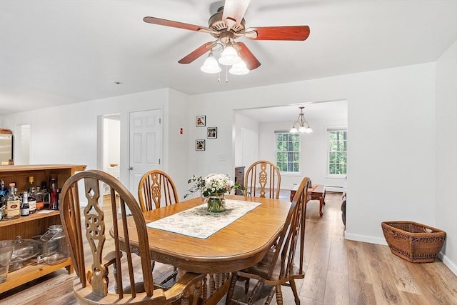 935 Old Keene Rd, Athol, MA 01331 - dining area featuring light wood-style flooring, ceiling fan, and a chandelier