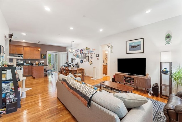 living area featuring recessed lighting and light wood-style floors