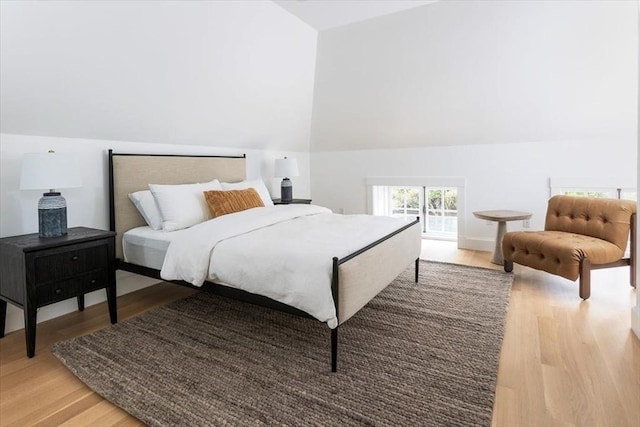 178 Ivy St, Brookline, MA 02446 - bedroom featuring light wood-style flooring and vaulted ceiling