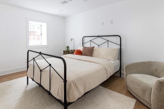 178 Ivy St, Brookline, MA 02446 - bedroom featuring wood finished floors and baseboards