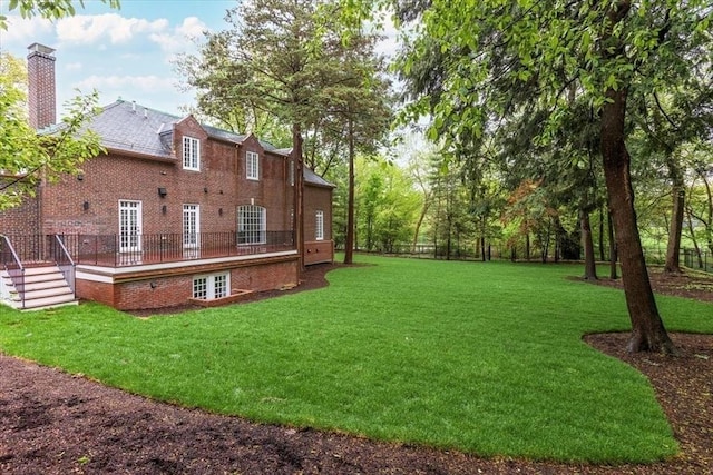 178 Ivy St, Brookline, MA 02446 - view of grassy yard featuring a wooden deck
