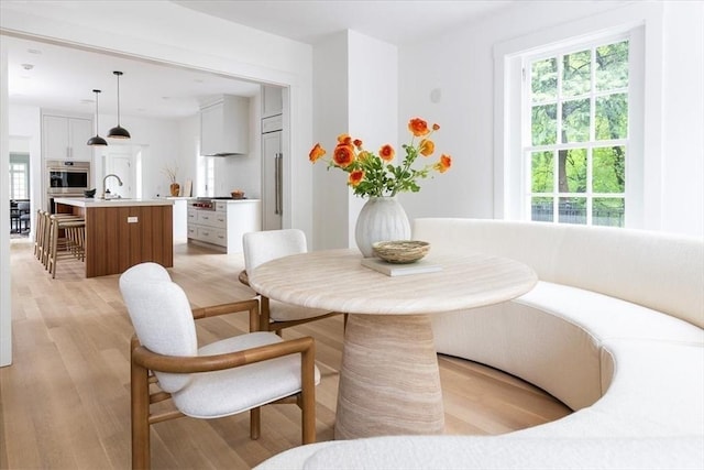 178 Ivy St, Brookline, MA 02446 - dining space with healthy amount of natural light and light wood finished floors