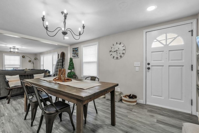 dining room featuring hardwood / wood-style flooring and a chandelier