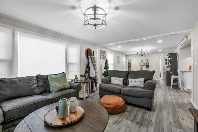 living room featuring hardwood / wood-style flooring and a chandelier