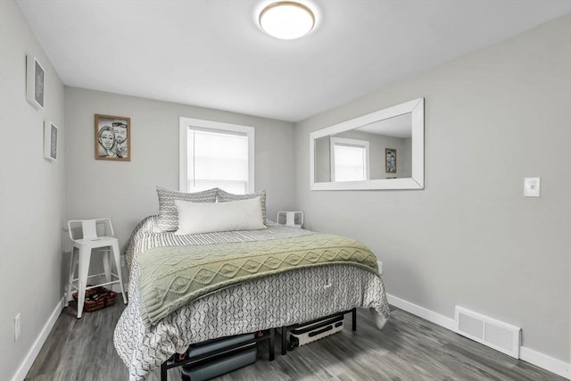 bedroom featuring dark hardwood / wood-style flooring