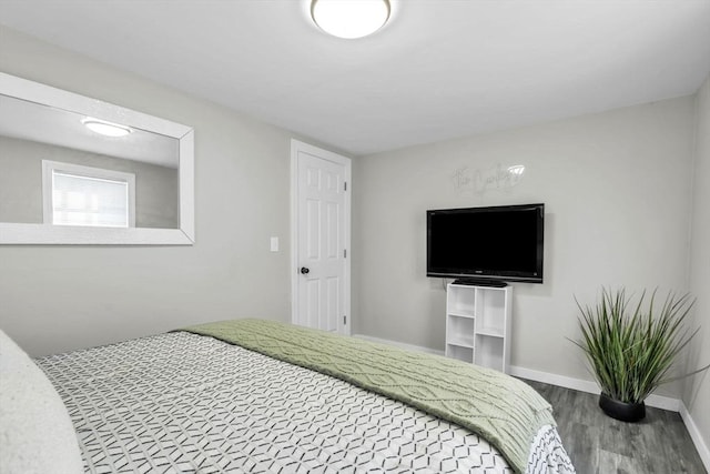 bedroom with hardwood / wood-style flooring