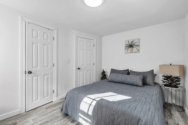 bedroom featuring light wood-type flooring