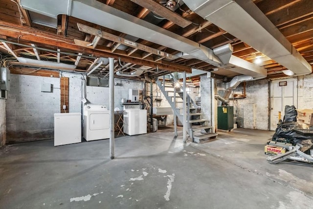 basement with separate washer and dryer and refrigerator