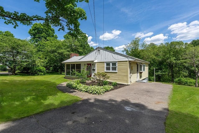 220 Pleasant St, Millis, MA 02054 - view of front of property with a front lawn and driveway