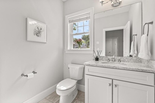 4 Fairfield Pl, Winchester, MA 01890 - bathroom featuring toilet, vanity, and baseboards