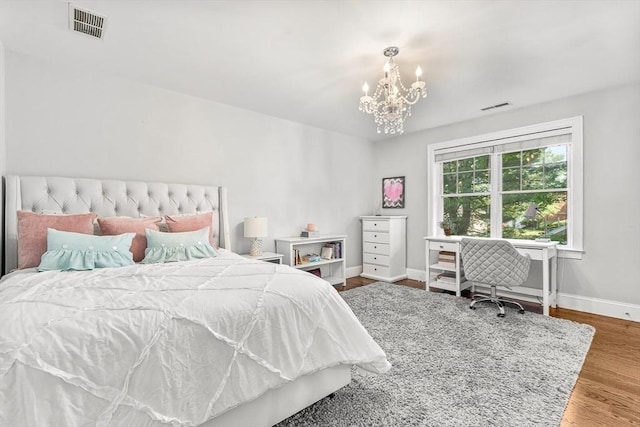 4 Fairfield Pl, Winchester, MA 01890 - bedroom featuring a chandelier, baseboards, and wood finished floors