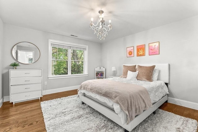 4 Fairfield Pl, Winchester, MA 01890 - bedroom featuring baseboards, a chandelier, and wood finished floors