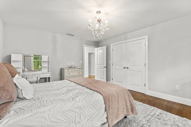4 Fairfield Pl, Winchester, MA 01890 - bedroom featuring a chandelier, baseboards, wood finished floors, and a closet