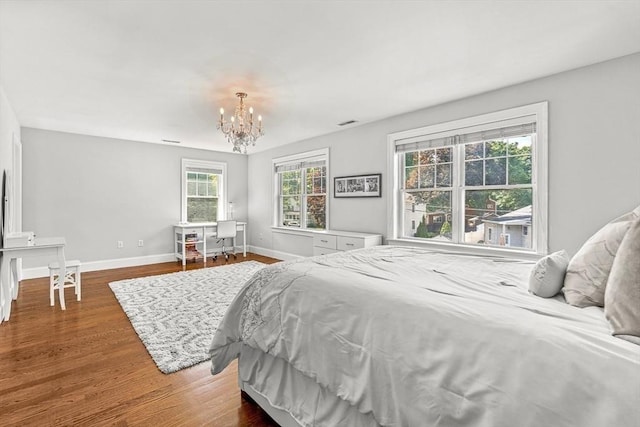 4 Fairfield Pl, Winchester, MA 01890 - bedroom with a chandelier, baseboards, and wood finished floors